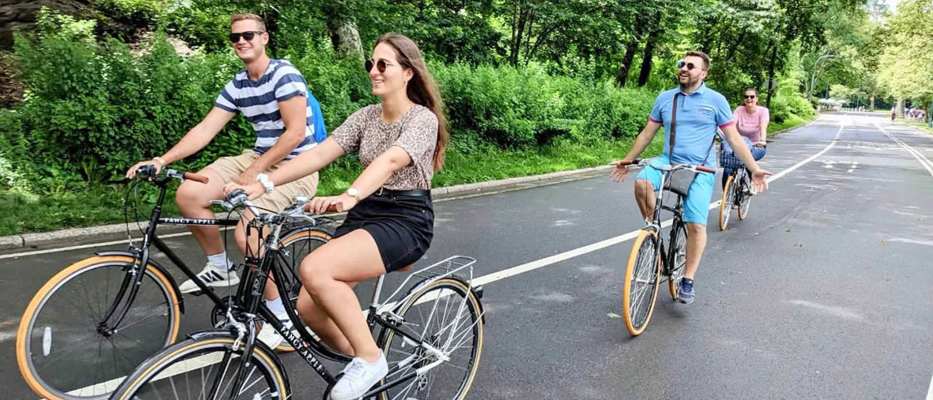 Small group riding together on a Central Park drive