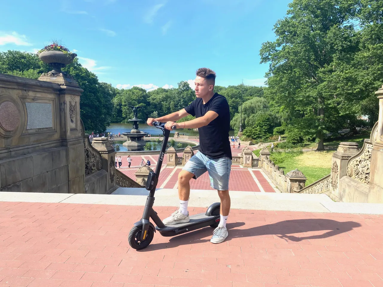 Rider on an electric kick scooter at Bethesda Terrace