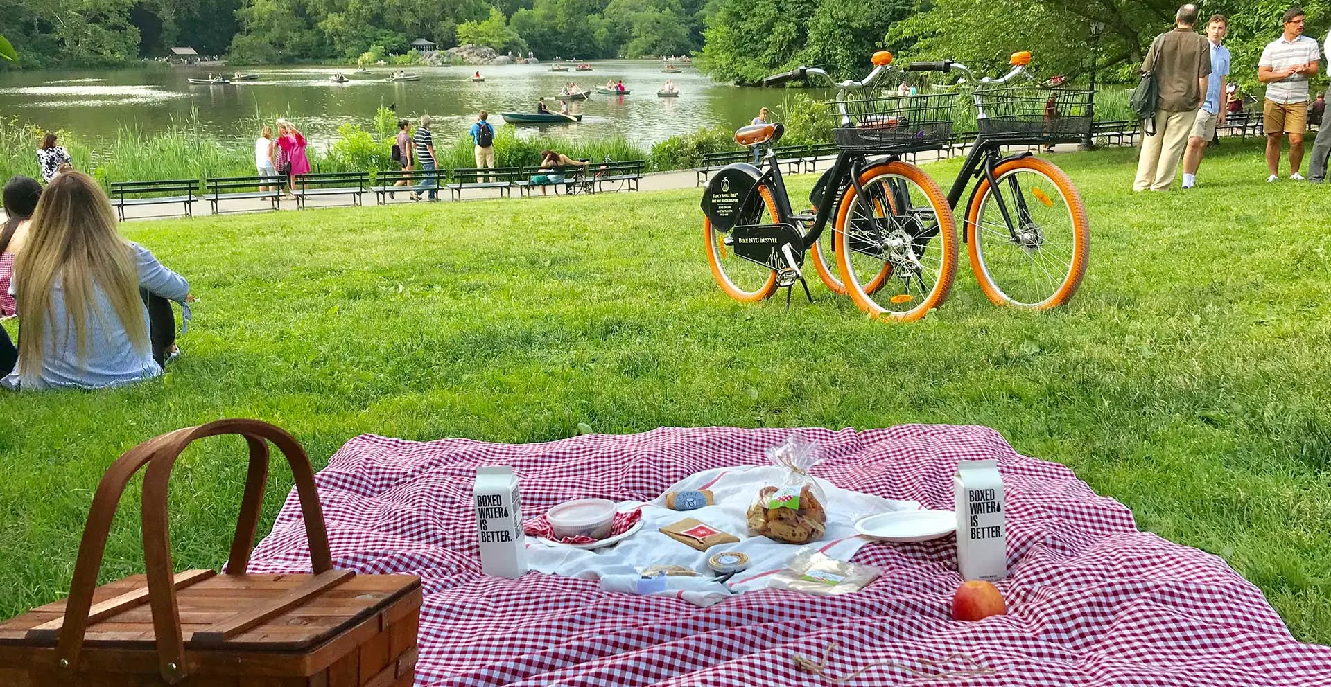 Visitors strolling the lakeside path in Central Park