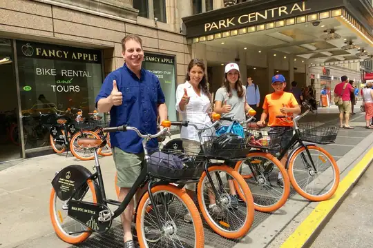 Four riders with rental bikes outside the Central Park shop